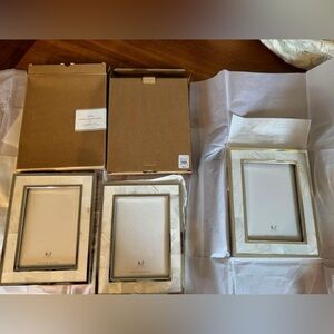 Three pottery barn mother of pearl 5x7 frames. New in original boxes.
